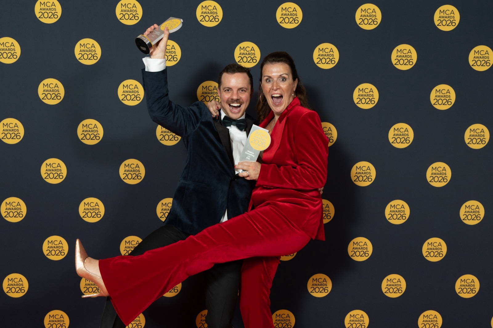 Magnus Consulting celebrating with an MCA Awards 2026 trophy