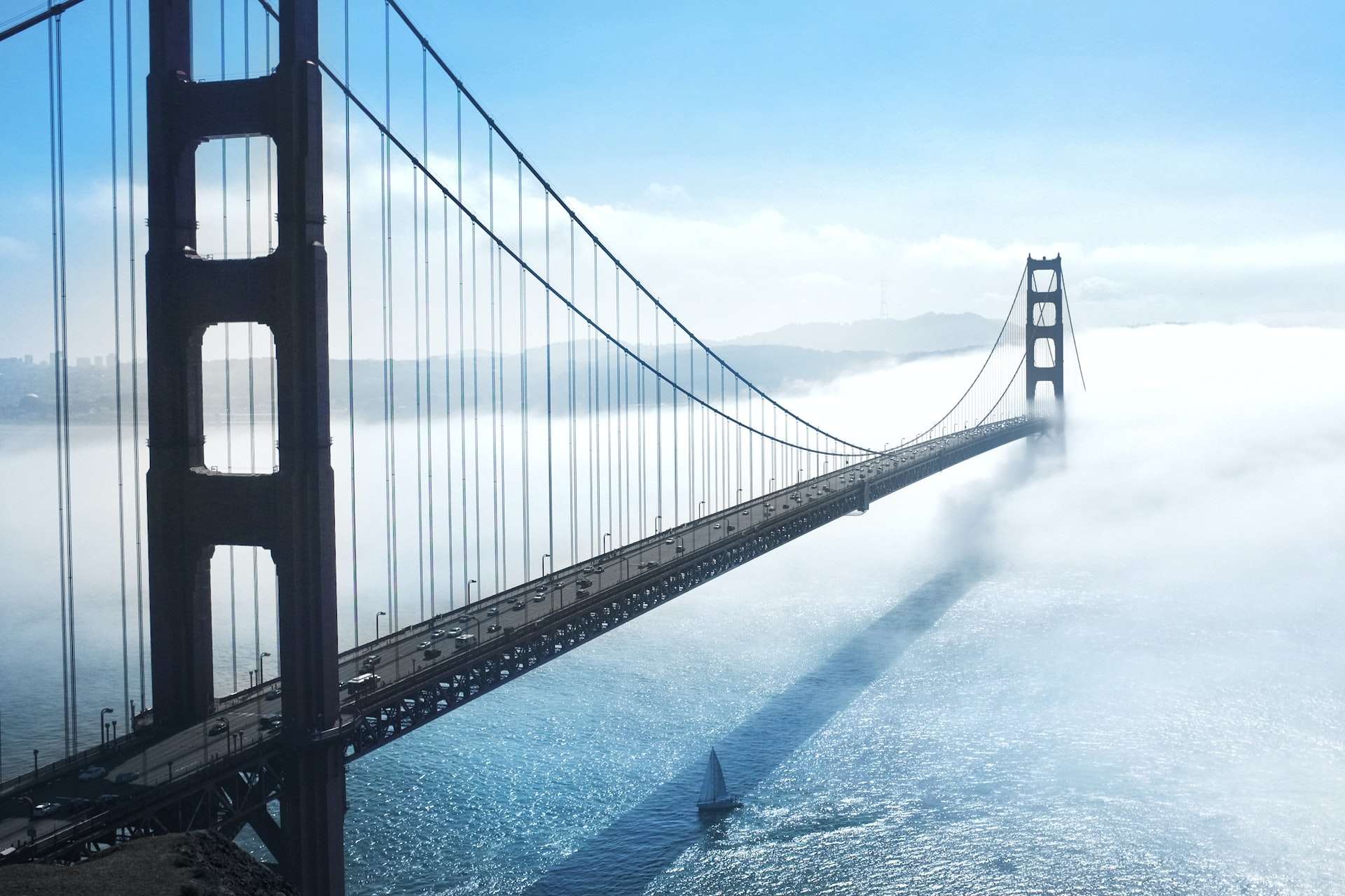 Bridge stretching into cloud