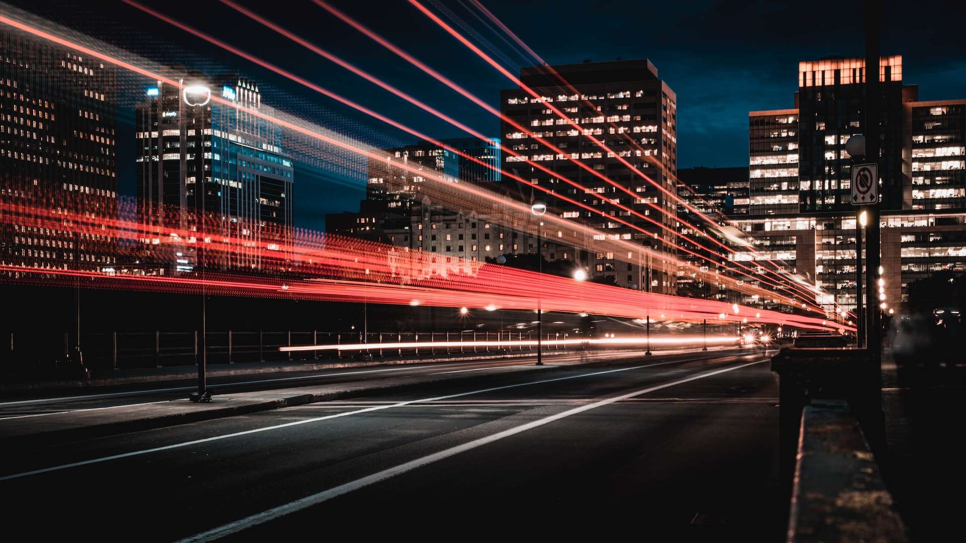 fast moving red lights in city depicting the role of marketing