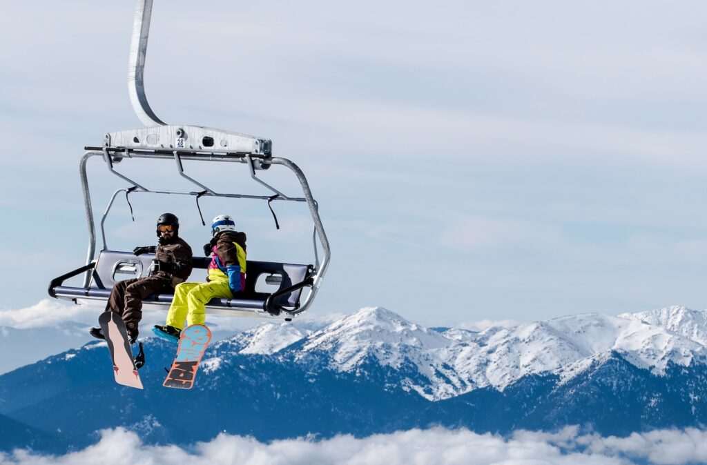 Two people on a ski chair lift. Image for chief growth officer blog.