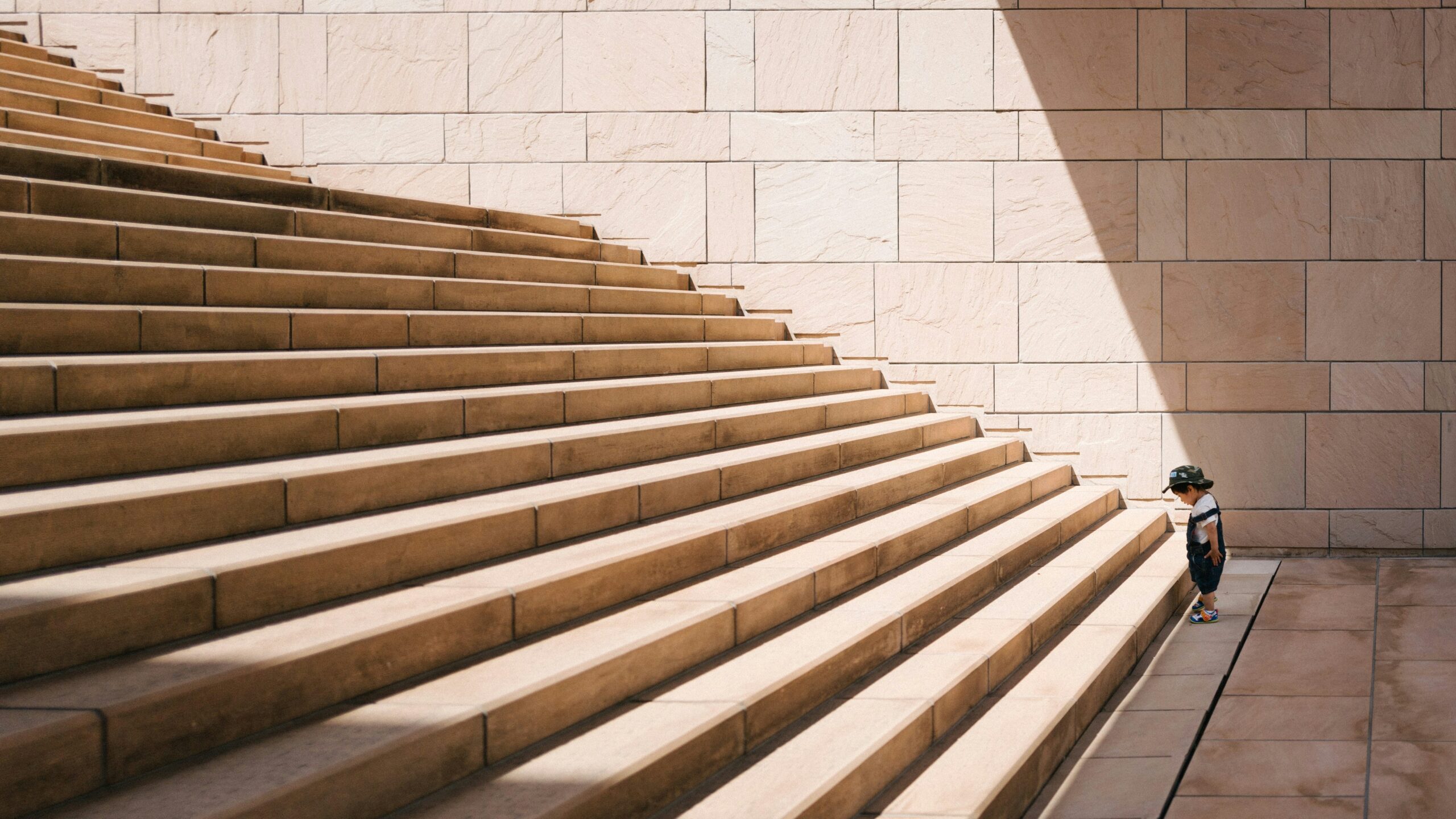 A toddler standing by the stairs and thinking about marketing as a strategic growth driver